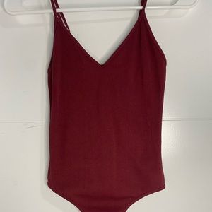Marrón V cut bodysuit.